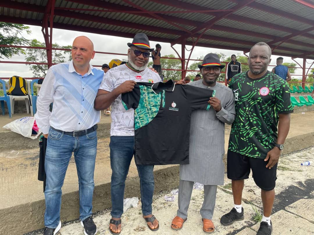 Group of people holding a jersey