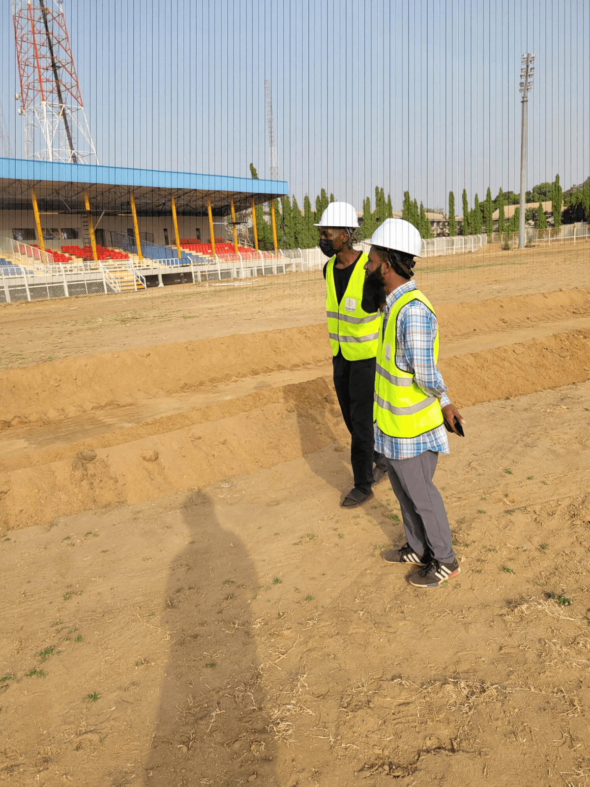 Engineer inspecting stadium site